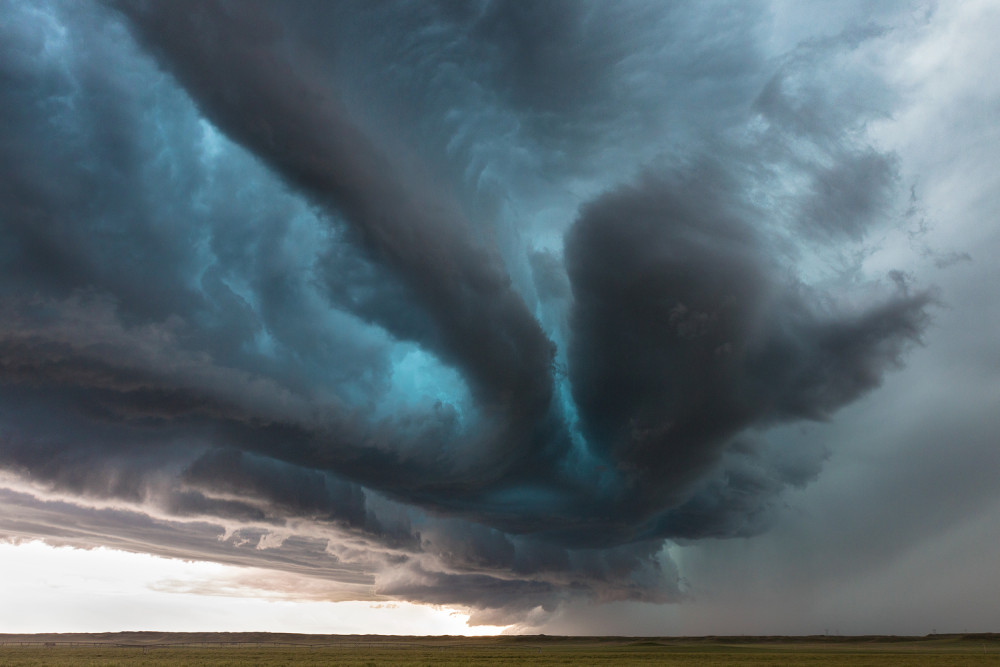 amazing teal color from the hail core of a supercell outside of Mitchell, Nebraska. This storm had baseball sized hail when I captured this. The color comes from the reflectivity of the larger hail, glows teal!