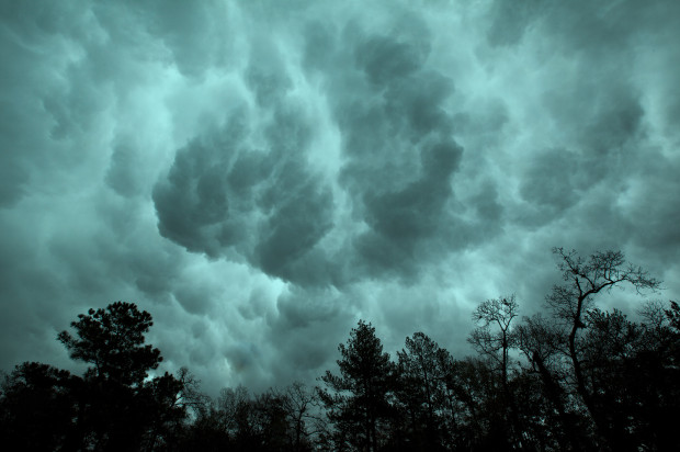 Storm clouds above looking like waves crashing overhead